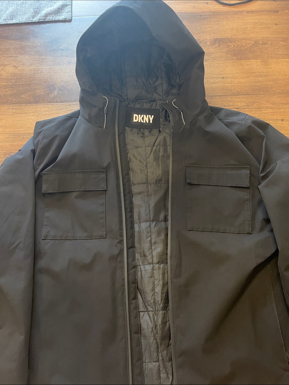 DKNY Black Hooded Coat with Chest Flap Pockets and Quilted Lining